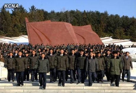 Party cell secretaries solemnly walk though the Revolutionary Martyrs' Cemetery on 26 January 2013 (Photo: KCNA)