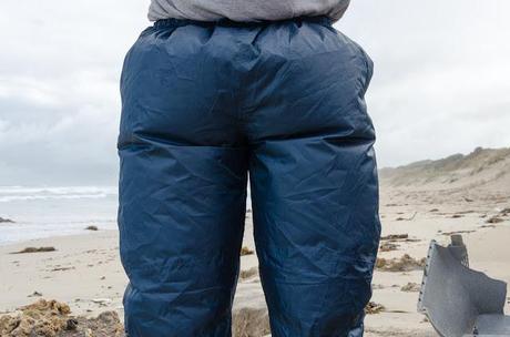 waterproof overpants puffed up by wind