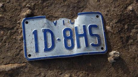victorian number plate lying on track