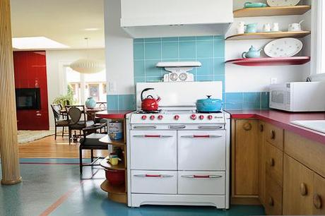 From Retro Renovation, a really cool example of formica used well with natural wood cabinets and white appliances. 