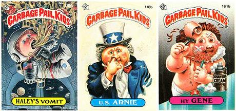 three Garbage Pail Kids trading cards from mid-1980s, Haley's Vomit as astronaut puking in space capsule, U.S. Arnie in Uncle Sam outfit picking his nose, Hy Gene shaving skin off his face and bleeding