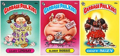 three Garbage Pail Kids trading cards from mid-1980s, Leaky Lindsay holding huge mass of snot that has dripped from her nose, Slobby Robbie an enormous fat obese baby, Oozy Suzy who has a burning wick in her skull and is melting like candle wax