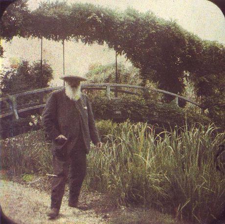 Claude Monet beside the Water Lily Pond bridge in 1917
