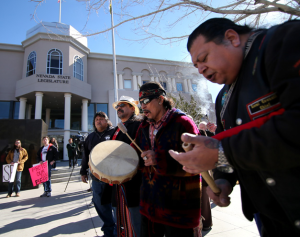 From left, Martin Cueva, Ocelotl Ortiz and Pete Casillas Jr. perform a Round Dance in front of the Legislative Building in Carson City on Monday. The rally was held in support of a bill that would prevent hunting of black bears in Nevada. 