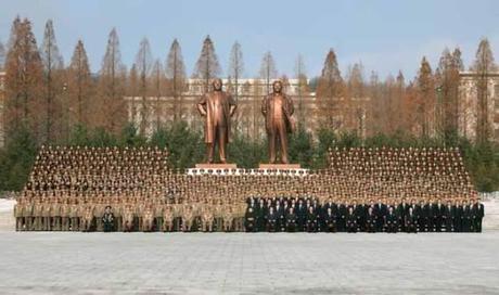 Kim Jong Un poses for a commemorative photograph with participants at a meeting of 