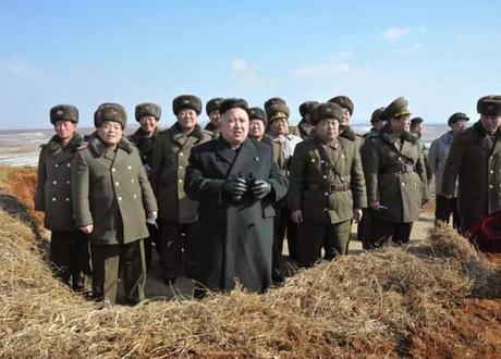 Kim Jong Un (4th L) holding binoculars during his field inspection of KPA Large Combined Unit #630 (Photo: Rodong Sinmun)
