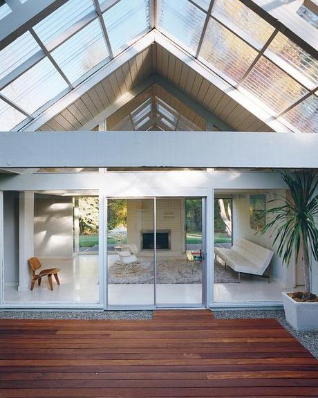 Modern deck with peaked ceiling and wooden flooring