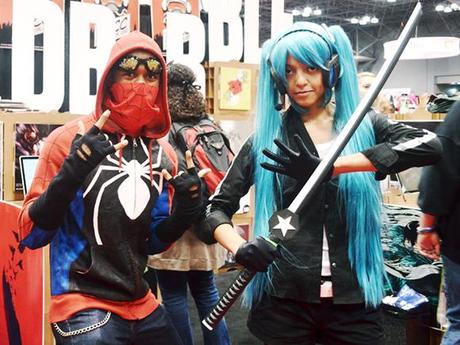 Alas, I Failed To Win The Big New York Comic Con Poster Contest couple wearing Spiderman and ninja manga superhero costumes and posing in front of RedBubble booth at 2012 New York Comic Con comics and pop culture convention