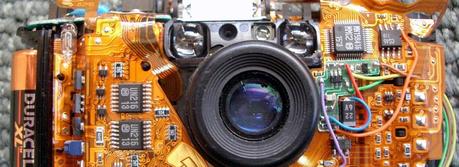 First Demonstration of a Stretchable Li-Ion Battery An Olympus Stylus camera without the case, showing the flex circuit assembly. (Credit: This image was originally posted to Flickr by jurvetson at http://flickr.com/photos/44124348109@N01/2265519)