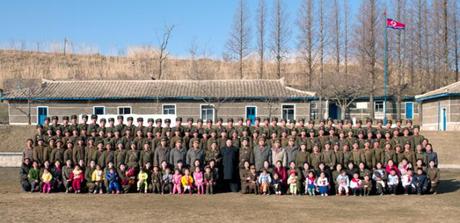 Kim Jong Un poses for a commemorative photograph with service members, officers and their family members during a field inspection of Wolnae Islet's defense unit on 11 March 2013 (Photo: Rodong Sinmun)