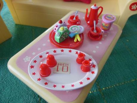 Dolly Review: Kurhn Doll with Living Room Set Food pieces on yellow plastic table