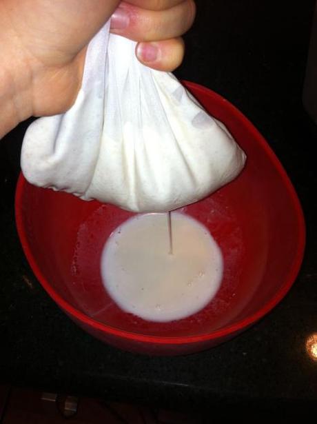 Almond Milk with a Nut Milk Bag Squeezing nut milk