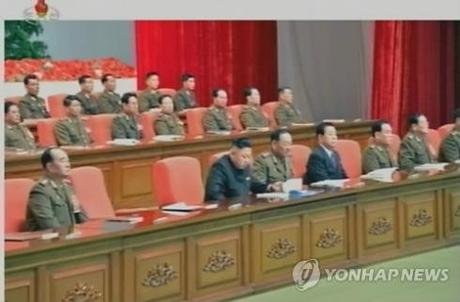 Kim Jong Un (2nd L, front row) attends a meeting of KPA information officers at the 25 April House of Culture in Pyongyang on 28 March 2013.  Also seen in attendance in the front row are Gen. Kim Kyok Sik (L), Gen. Hyon Yong Chol (3rd L) and Kim Kyong Ok (4th L) (Photo KCTV-Yonhap)