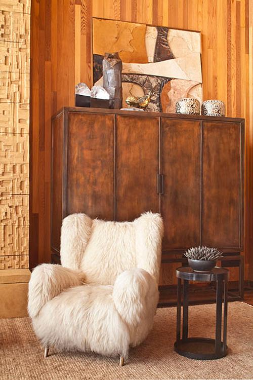 Kelly Wearstler beach house living room wood paneling fur covered chair