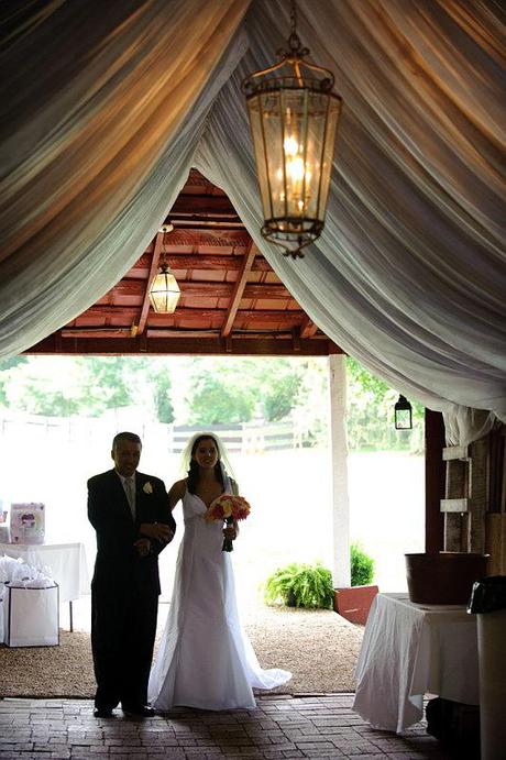 Bride Enters through a barn