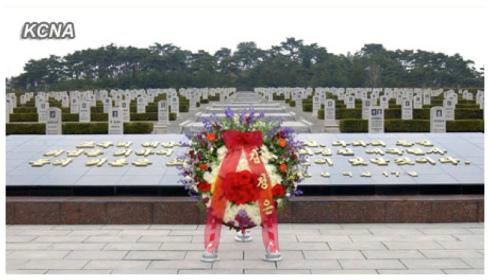 A floral basket from Kim Jong Un sits in front of a monument and memorial stones at the Patriotic Martyrs Cemetery in Pyongyang on 24 April 2013.  The floral wreath was delivered to mark the official foundation of the Korean People's Army, which is commemorated on 25 April. (Photo: KCNA)