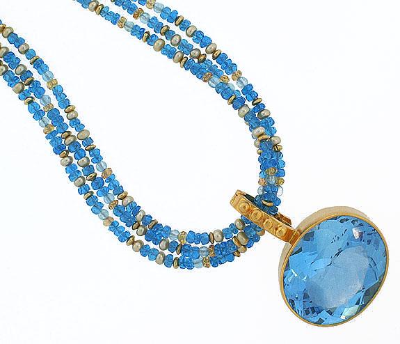 Vibrant blue topaz on necklace of mixed apatite, pearl, citrine and 18k gold vermeil