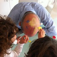 Face painting a bald head
