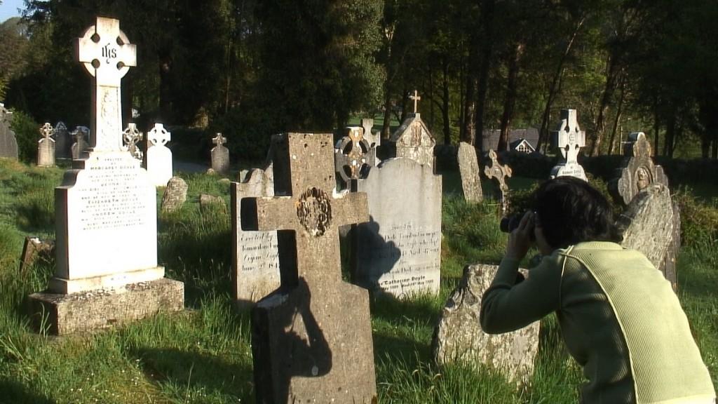 Glendalough, one of the most beautiful places in Ireland jean takes a picture in the graveyard at glendalough - wicklow - ireland