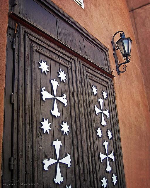 The beautifully carved wooden mission doors at Santa Cruz de la Canada mission.