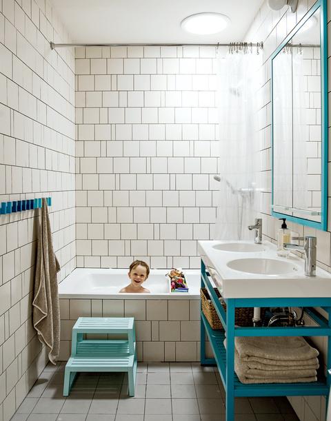 Modern bathroom with irregular tiled wall