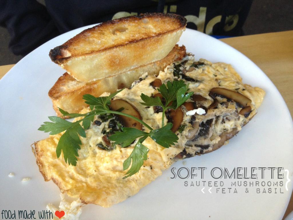 Soft omelette with mushrooms, feta and basil