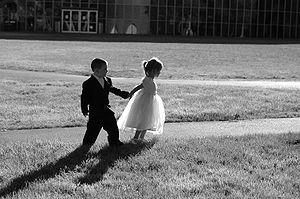 Black and white image of 2 children at wedding