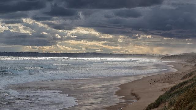 dark clouds over woolamai surf beach
