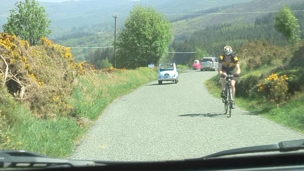 Driving the Intriguing Backroads of Wicklow County – Ireland biker and traffic on country road - Enniskerry - Wicklow - Ireland