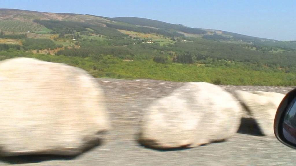 Driving the Intriguing Backroads of Wicklow County – Ireland a blur of rocks along roadway - Enniskerry - Wicklow - Ireland