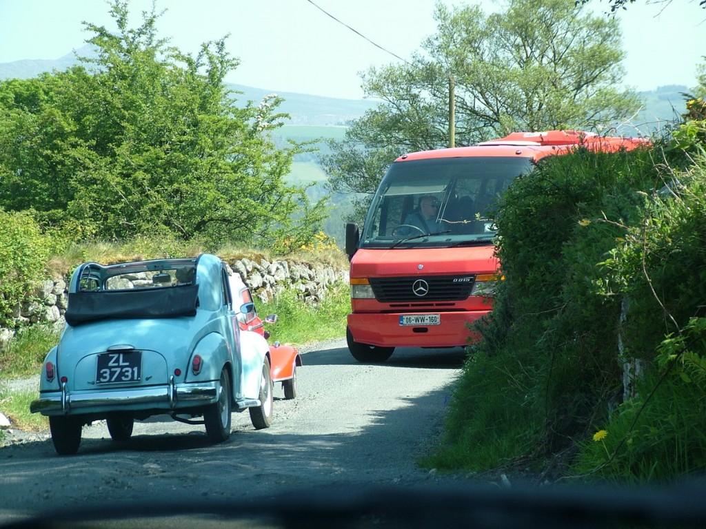 Driving the Intriguing Backroads of Wicklow County – Ireland Red Messerschmitt KR- 175 microcar meets bus on tight road - Enniskerry - Wicklow - Ireland