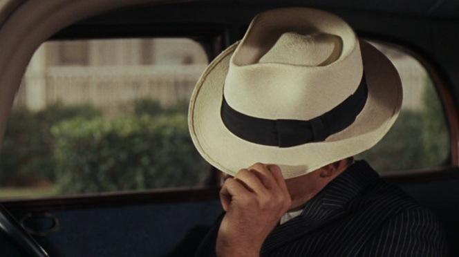 Clyde Barrow’s Dapper Dark Pinstripe Suit Effective as headgear in warm weather and hiding your face so nosy neighbors won't send the laws after you.