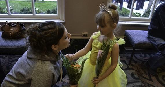 Little girl gets flowers for her ballet recital.