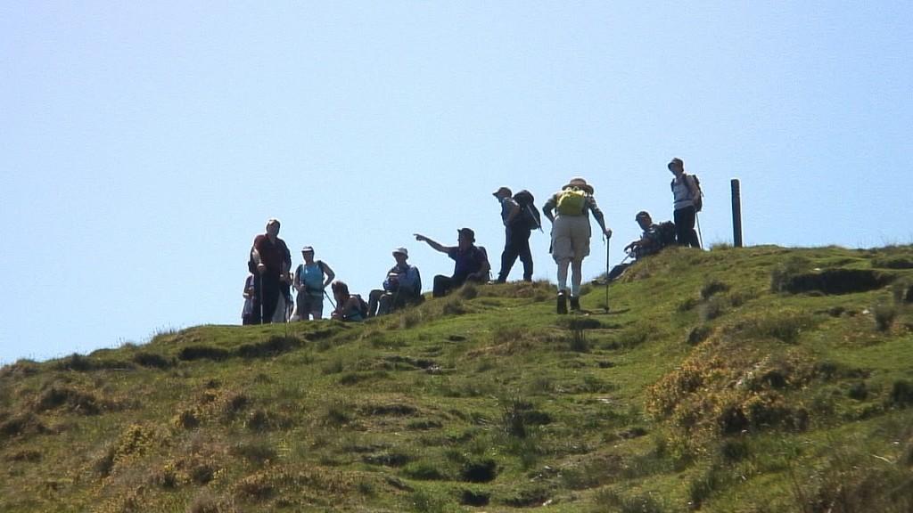 Hiking In Wicklow Mountains National Park – Ireland jean climbs final steps to top of mullacor mountain - wicklow - ireland