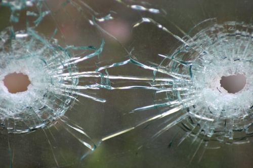 Fast Bullets and Broken Glass bullet_holes_in_glass