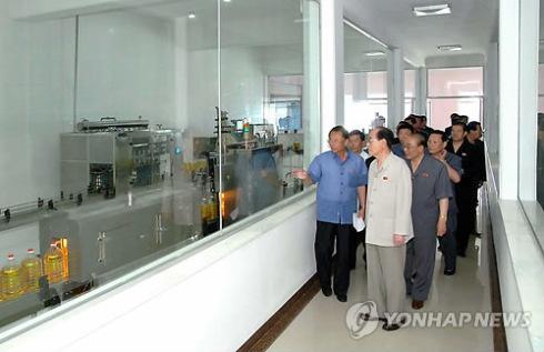 DPRK head of state Kim Yong Nam and other senior officials tour the Pyongyang Essential Foodstuffs Factory (Photo: KCNA-Yonhap).