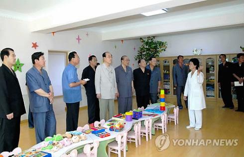 SPA Presidium President Kim Yong Nam and other senior DPRK government officials tour a childcare classroom at Pyongyang Essential Foodstuffs Factory (Photo: KCNA-Yonhap).