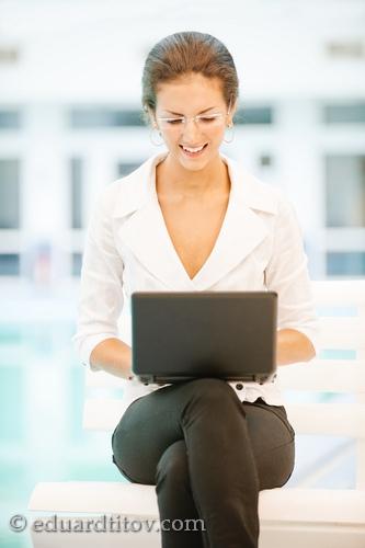 Businesswoman works on laptop