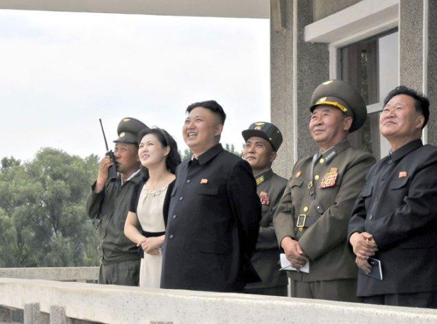 Kim Jong Un watches flight training by KPA Air Force Unit #1017.  Also seen in attendance is his wife Ri Sol Ju  2nd L), KPA Air Force Commander Gen. Ri Pyong Chol (4th L) and VMar Choe Ryong Hae (5th L) (Photo: Rodong Sinmun).