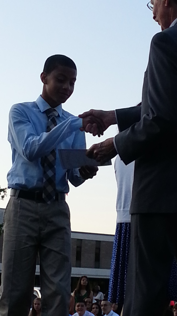 Jai getting his diploma