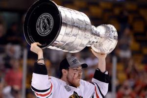 No glitz, no glamour: Lifting Lord Stanley's Cup over his head as blood streamed down his cheek, Andrew Shaw showed us the determined heart of a hockey player. (Click on image to enlarge) 