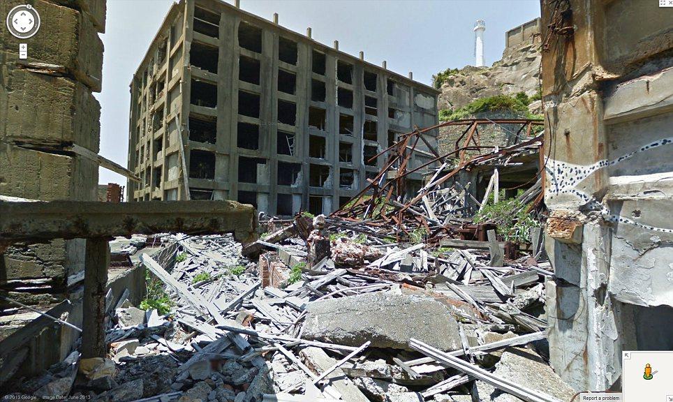 Once again it's that creepy coincidence thing - again! Eerie: Google sent one of its employees with a Street View camera backpack to roam the streets of Gunkanjima filming for its immersive map