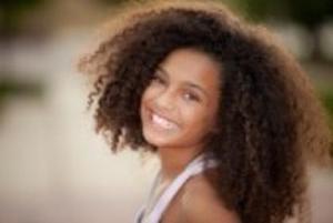 14738487-happy-smiling-african-descent-child-with-afro-hair-style