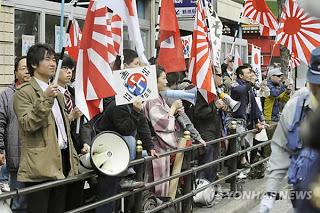 The Nazi Swastika and the Japanese Rising Sun Flag