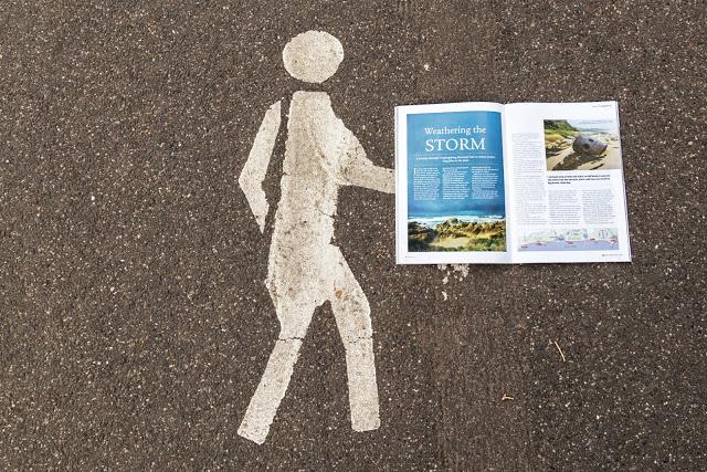 Man and a magazine pedestrian only painting on footpath