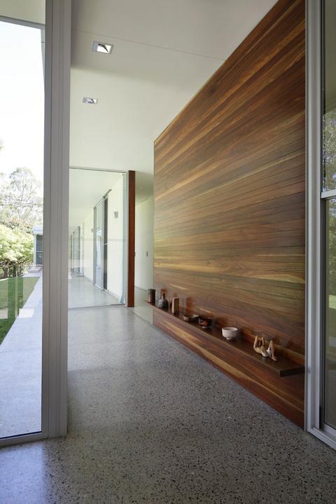 Modern hallway design with shelf wall