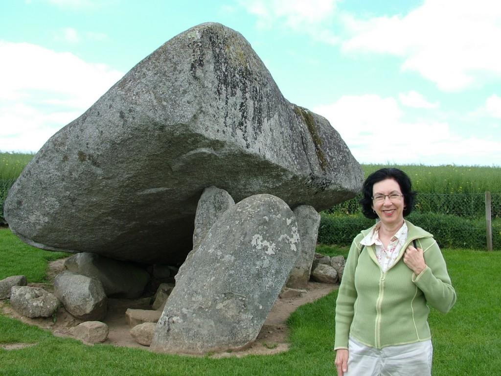 Our tour of the House of Waterford Crystal in Ireland jean stands in front of the brownshill portal tomb - county carlow - ireland