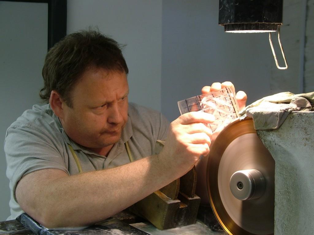 Our tour of the House of Waterford Crystal in Ireland cutting a pattern on a crystal glass - waterford crystal - ireland