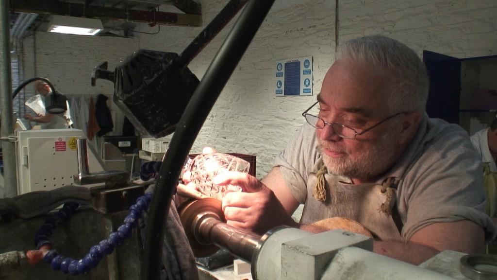 Our tour of the House of Waterford Crystal in Ireland man cuts crystal goblet - house of waterford - waterford - ireland