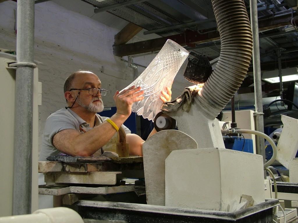 Our tour of the House of Waterford Crystal in Ireland checking a cutting on a vase - waterford crystal plant - ireland